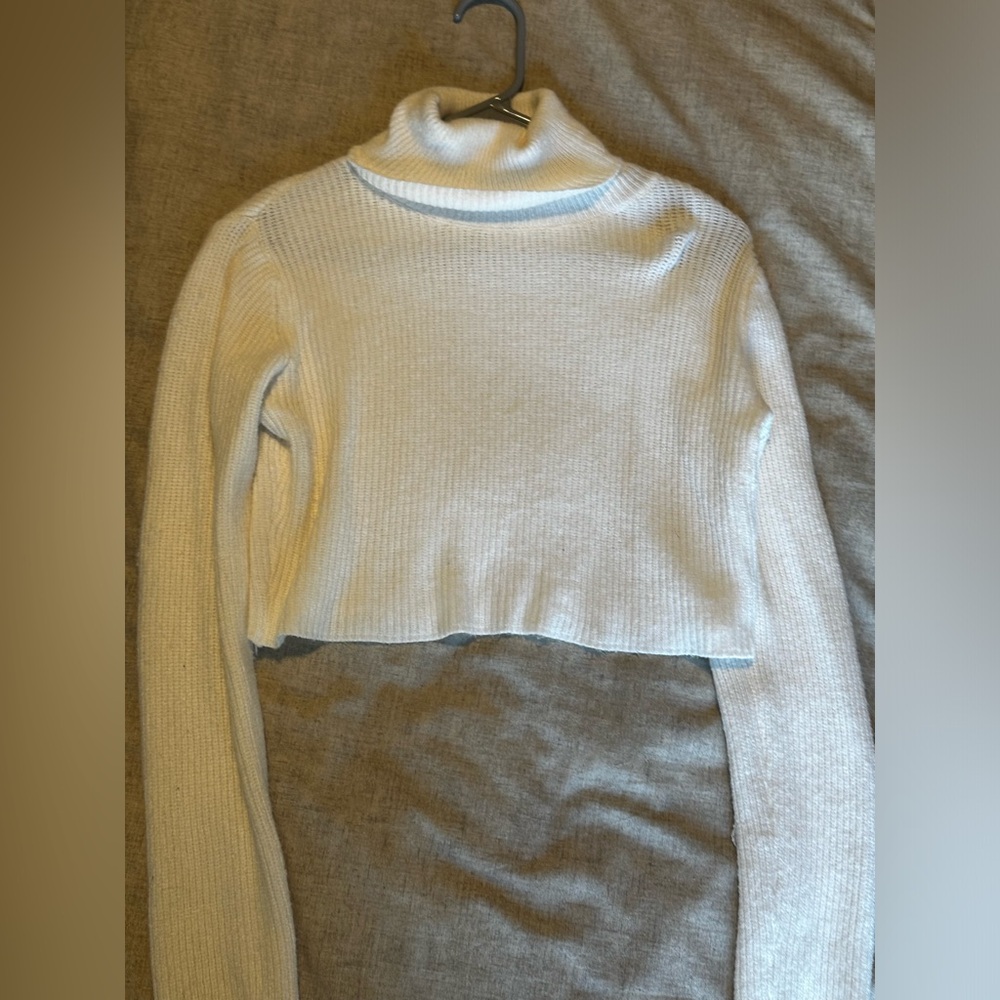 Cropped white turtleneck sweater